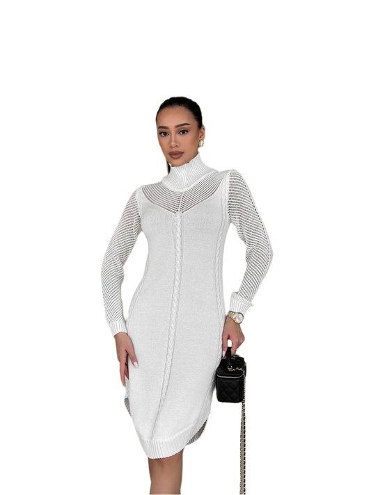 Woman wearing a white knit dress with a black handbag on a white background