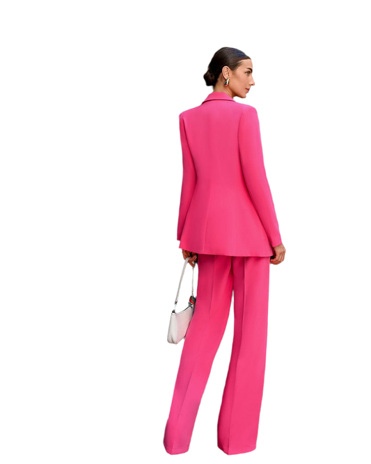 Woman wearing a bright pink suit on a white background