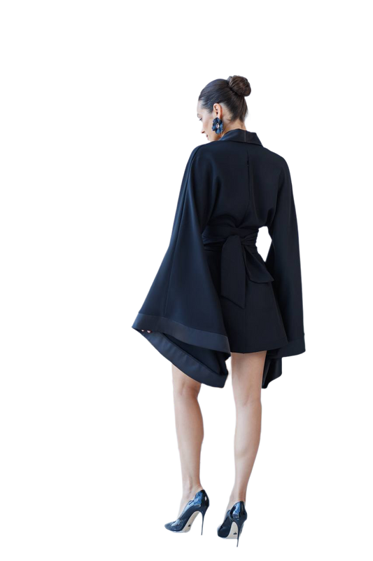 Person wearing a black coat with a white background