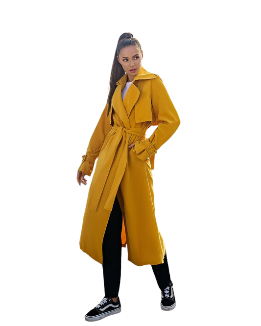 Woman wearing a yellow trench coat on a white background