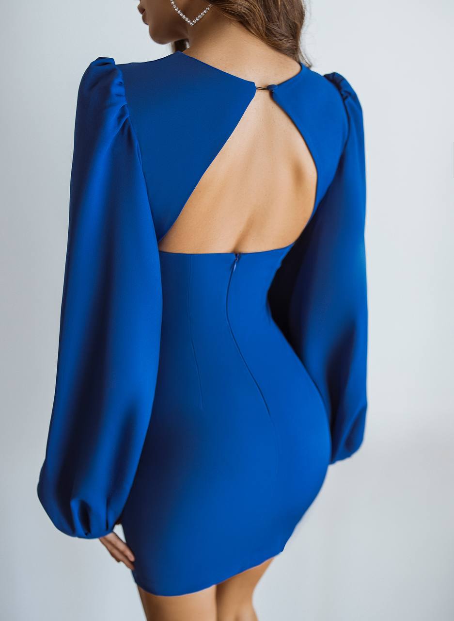 Blue dress with open back on a plain background