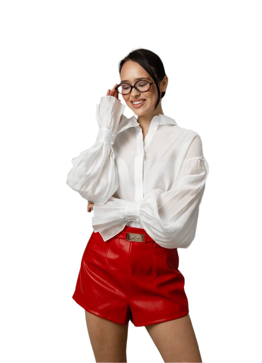 Woman wearing a white blouse and red shorts on a white background