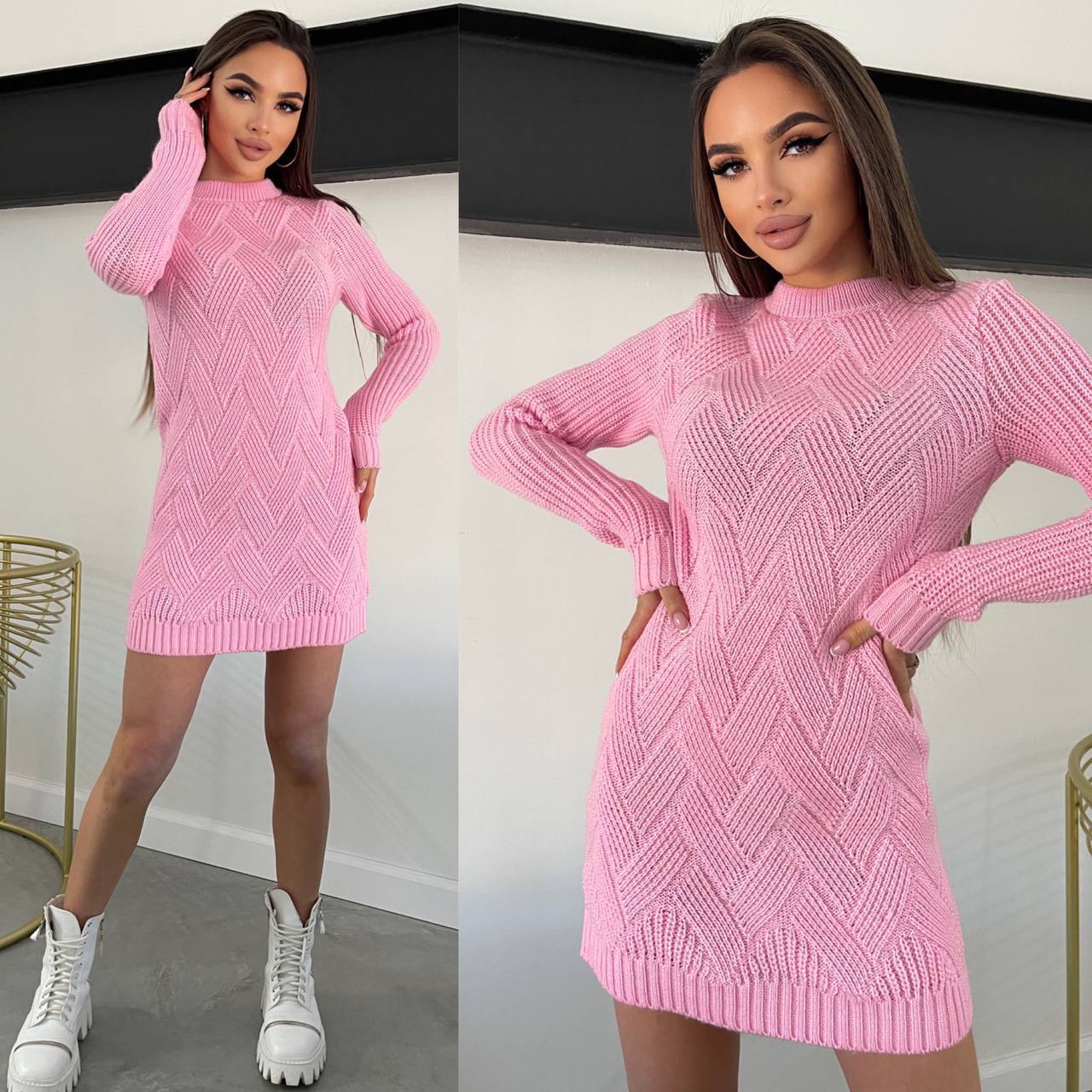Woman wearing a pink knitted dress with a plain background