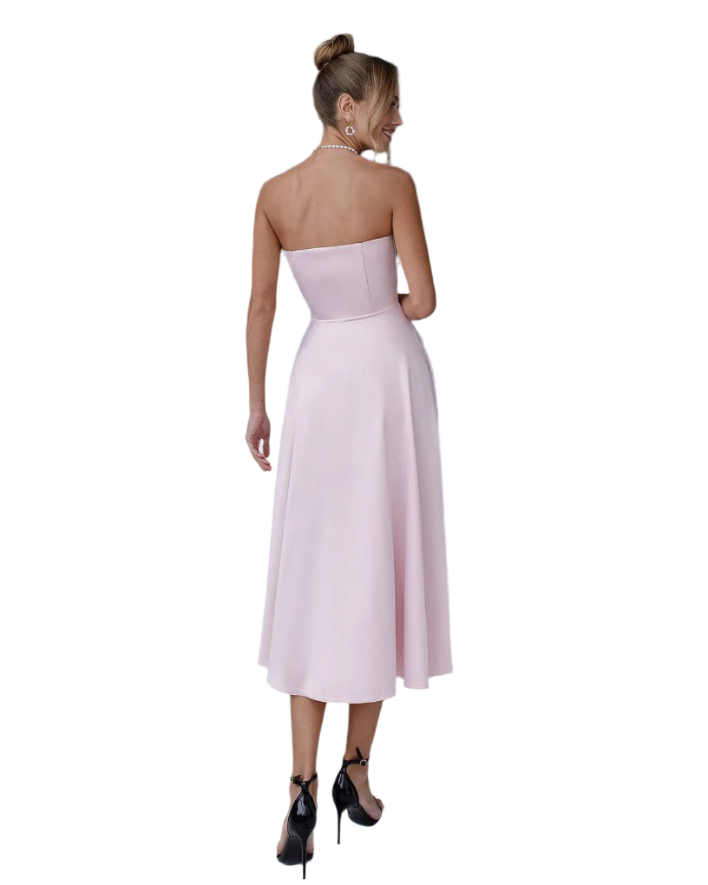 Woman wearing a strapless pink dress on a white background