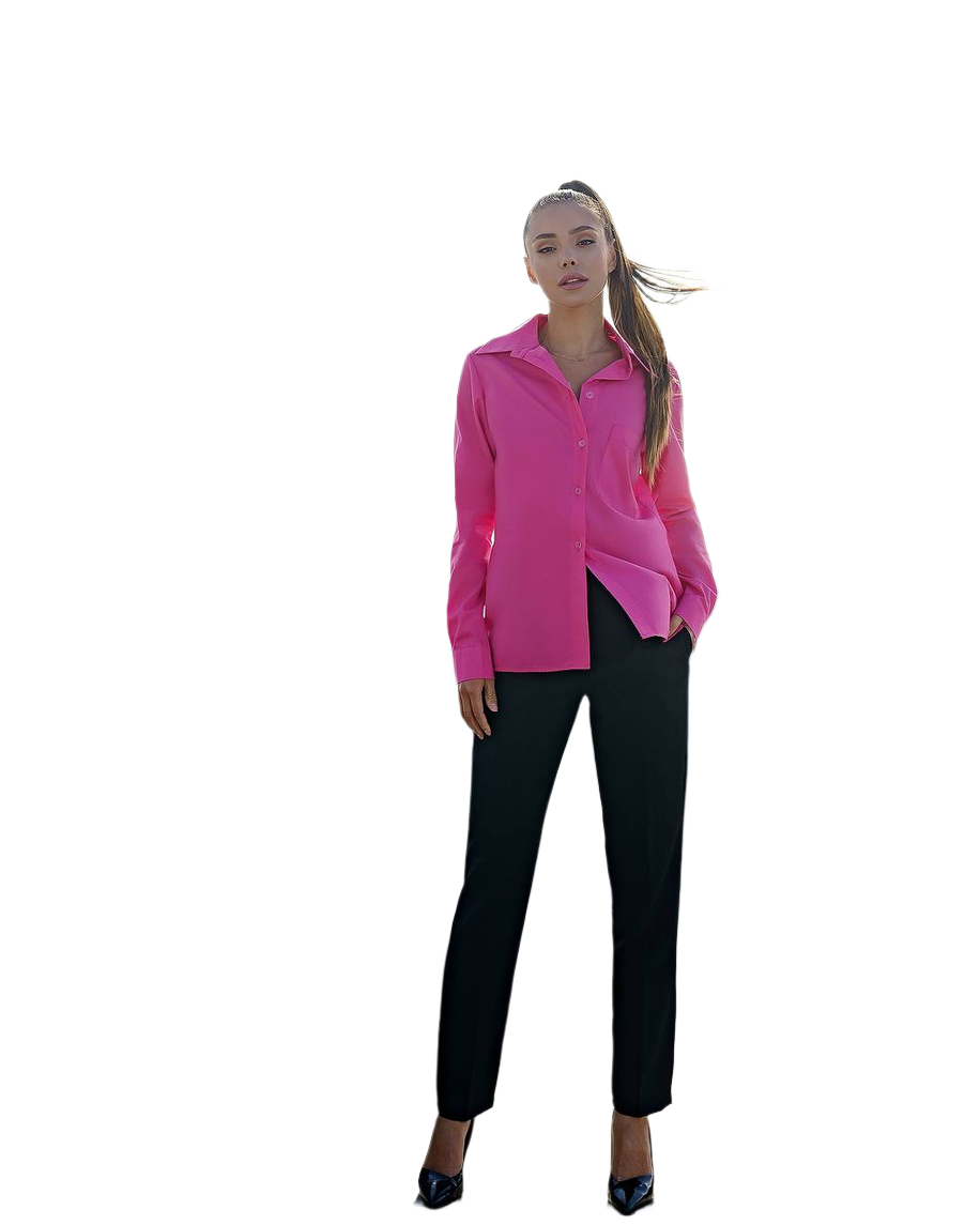 Woman wearing a bright pink blouse and black pants on a white background