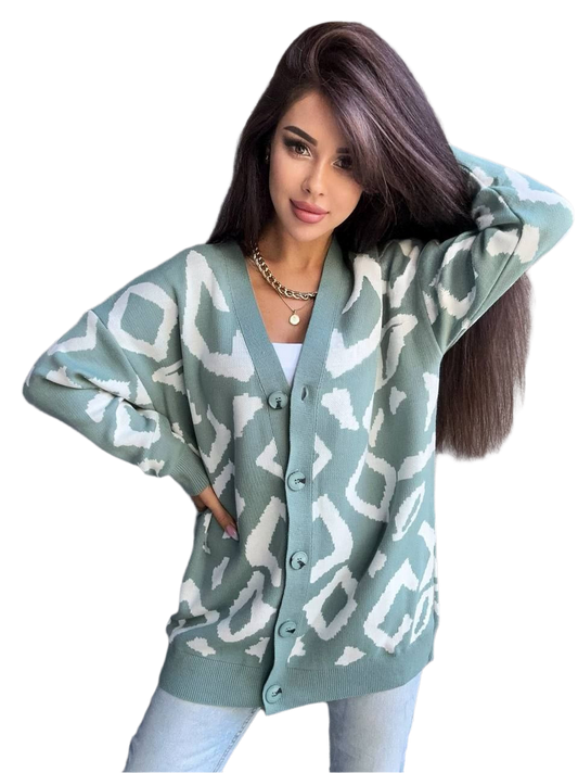 Woman wearing a light blue cardigan with white geometric patterns on a white background