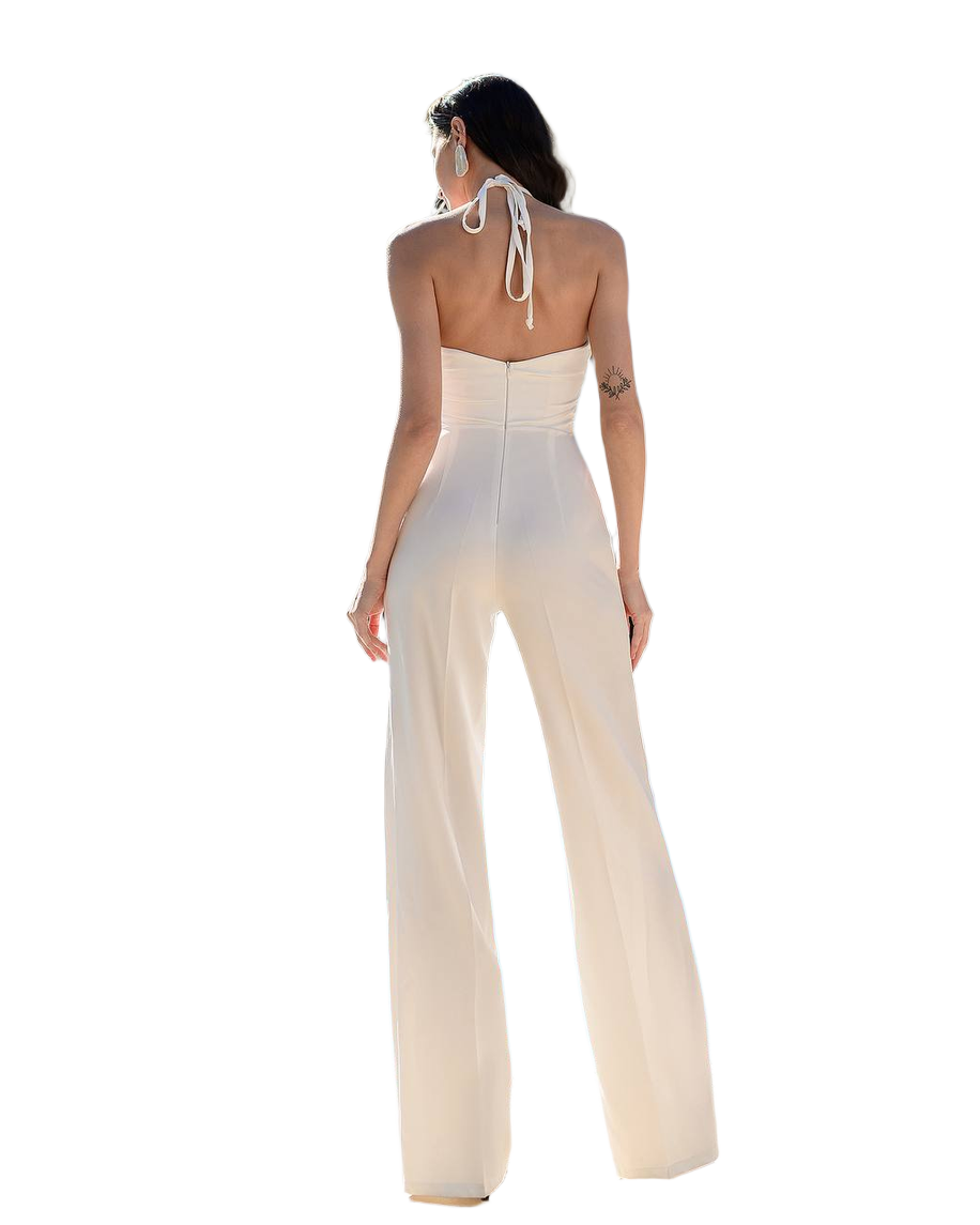 Woman wearing a white halter neck jumpsuit on a white background