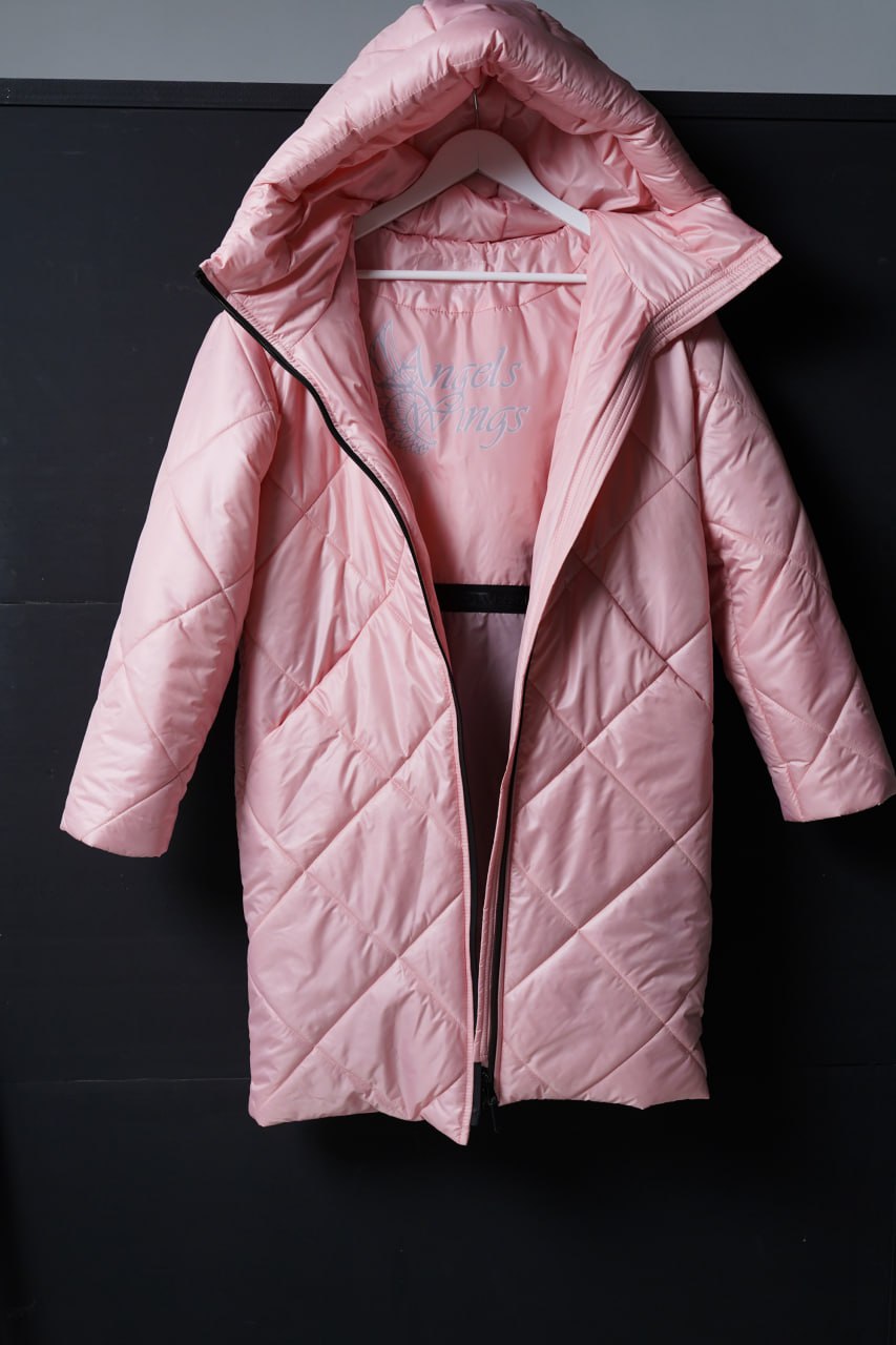 Pink quilted jacket on a black background