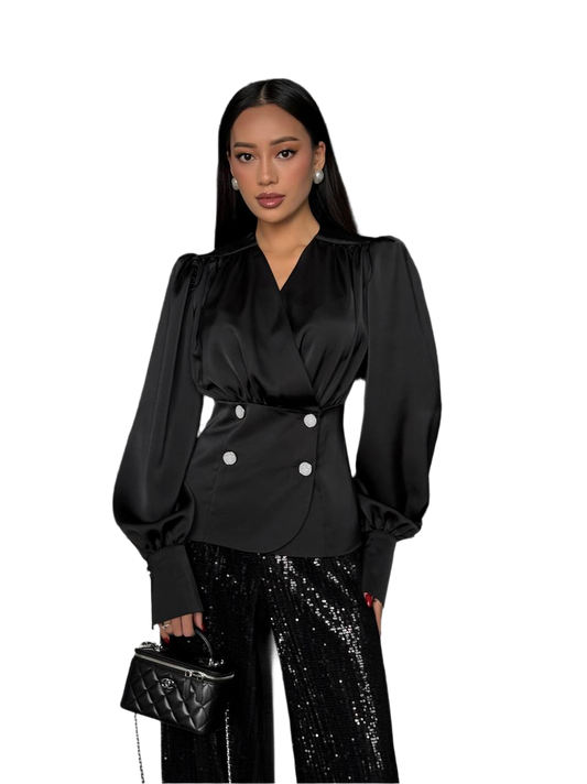 Woman wearing a black blouse with white buttons and black sequin pants on a white background