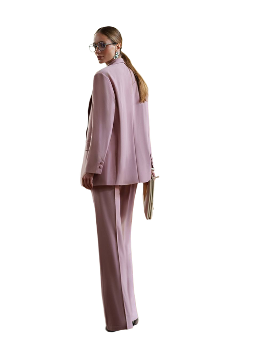 Woman wearing a pink suit on a white background