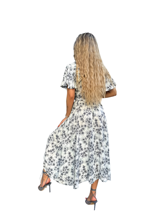 Woman wearing a floral dress on a white background