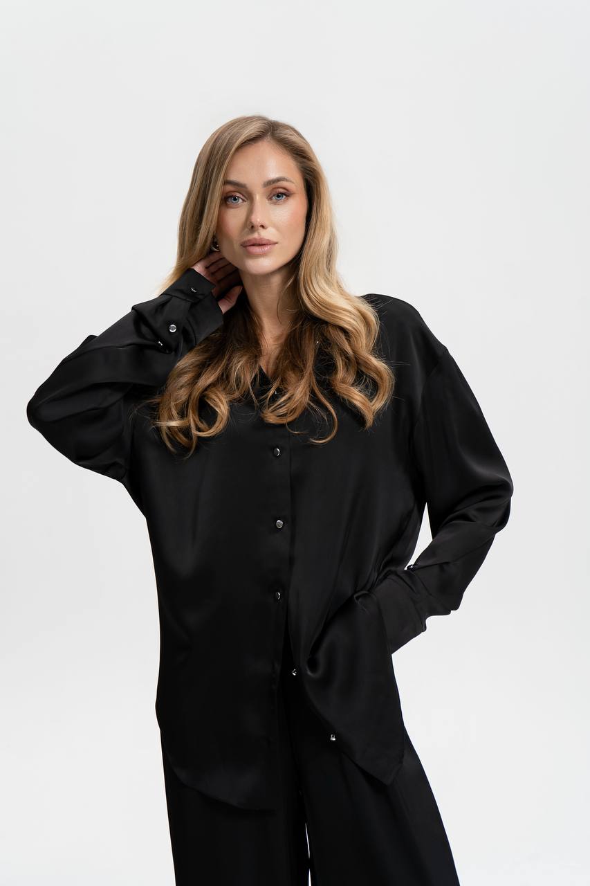 Woman wearing a black shirt with a white background