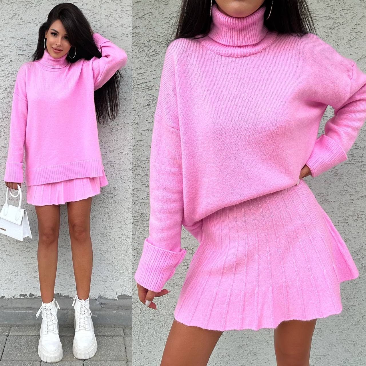 Woman wearing a pink knit outfit with a skirt against a gray wall.