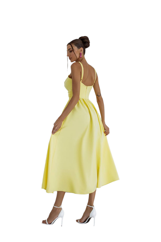 Woman wearing a yellow dress on a white background