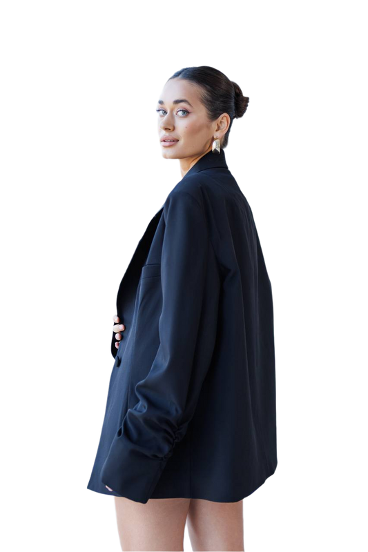 Woman wearing a black blazer on a white background