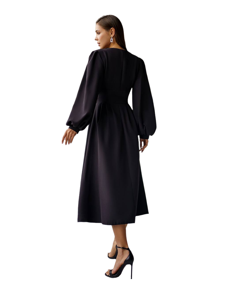 Woman wearing a black dress with long sleeves on a white background