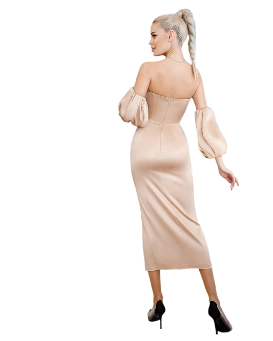 Woman wearing a beige off-shoulder dress with puffed sleeves on a white background