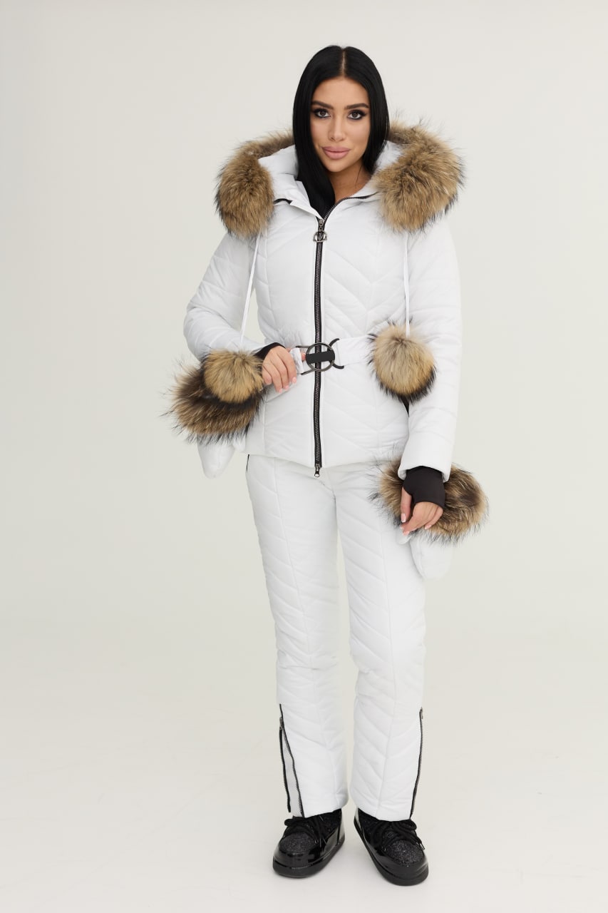 Person wearing a white winter suit with fur-lined hood and cuffs on a white background