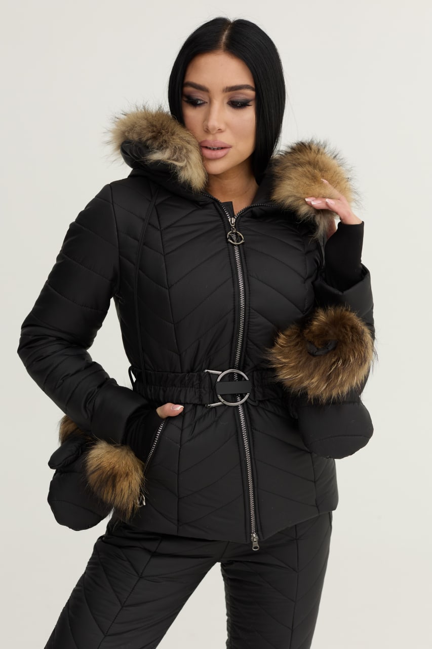 Woman wearing a black puffer jacket with fur trim on a white background