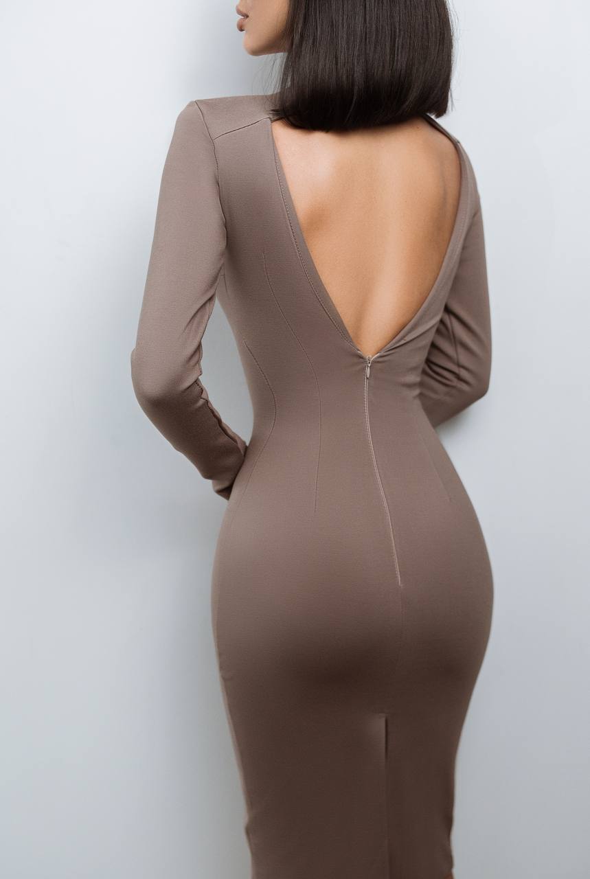 Brown dress with open back and long sleeves on a plain background