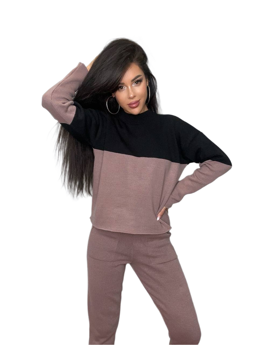 Woman wearing a two-tone outfit with a black and brown color scheme on a white background
