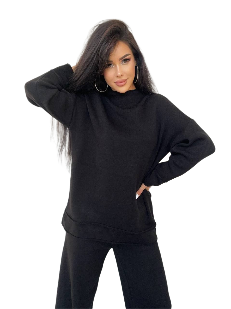 Woman wearing a black oversized hoodie on a white background