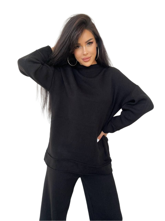 Woman wearing a black oversized hoodie on a white background