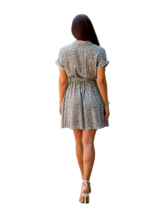 Woman wearing a patterned dress on a white background