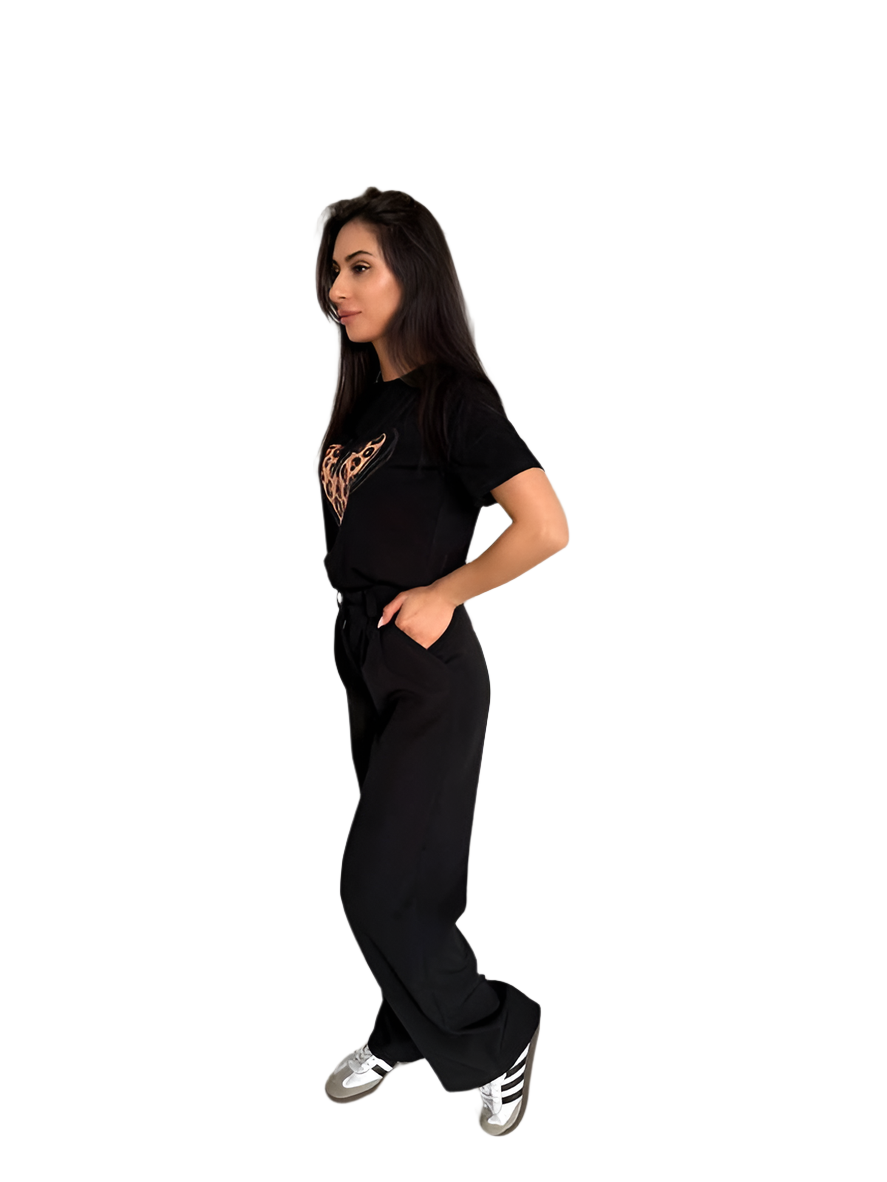 Woman wearing a black outfit with a logo on a white background