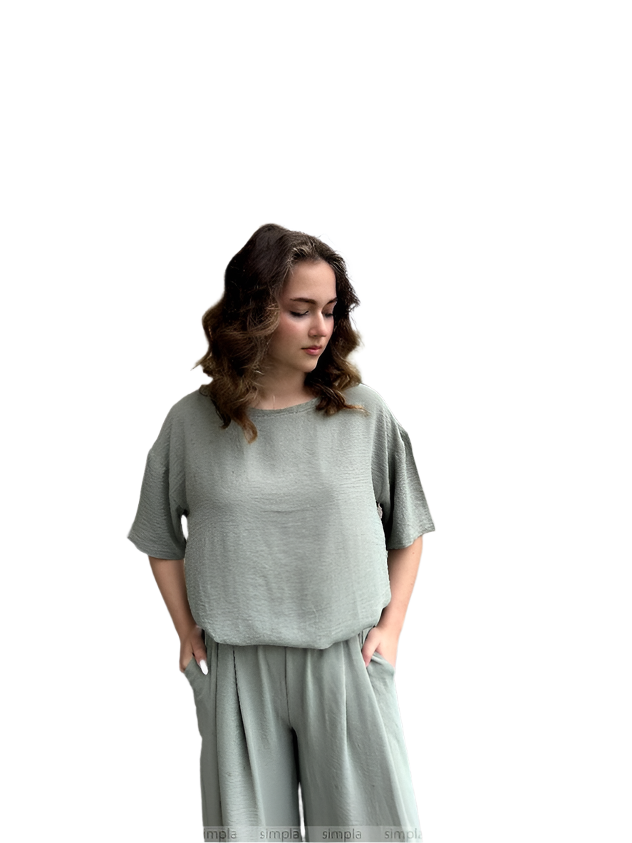 Woman wearing a gray outfit on a white background