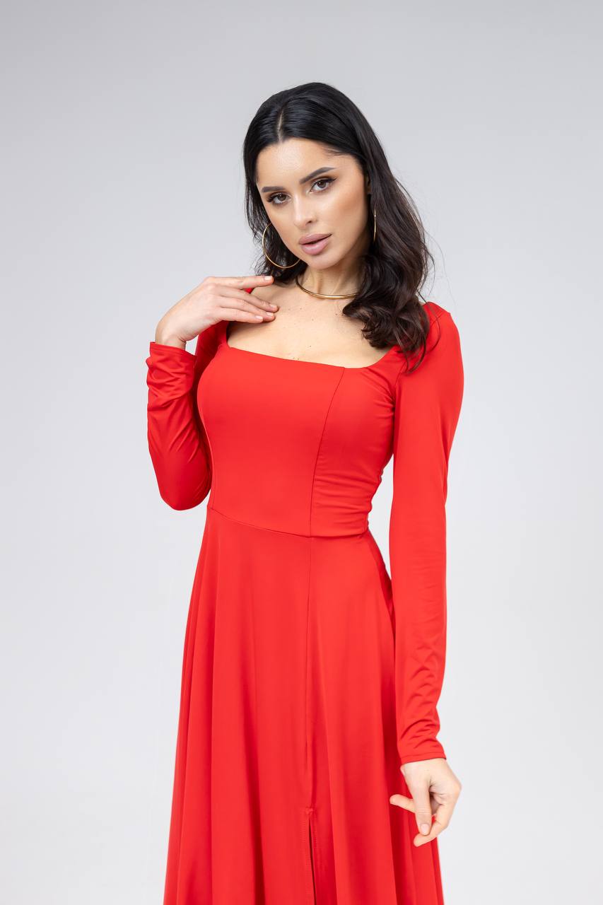 Woman wearing a red dress against a gray background