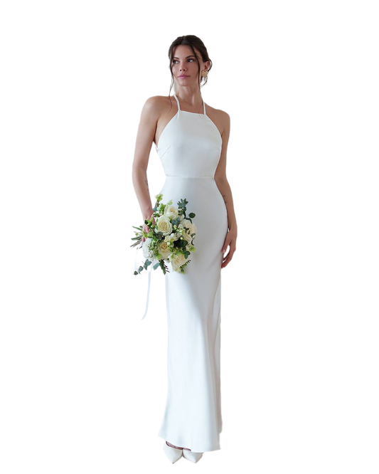 Woman in a white halter neck gown holding a bouquet of flowers on a white background