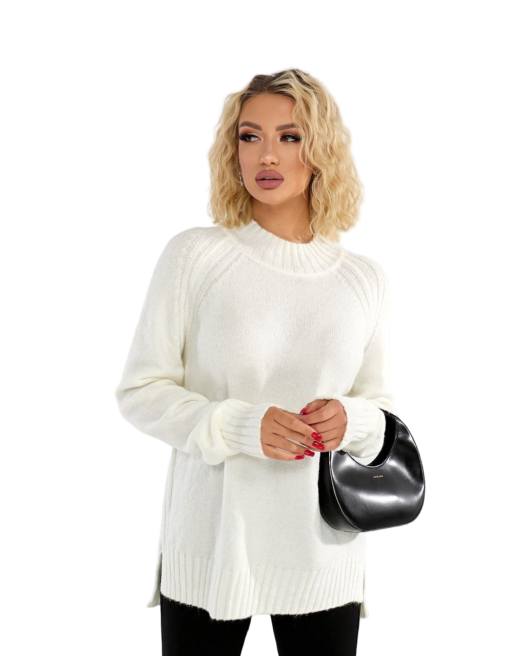 Woman wearing a white sweater holding a black handbag on a white background