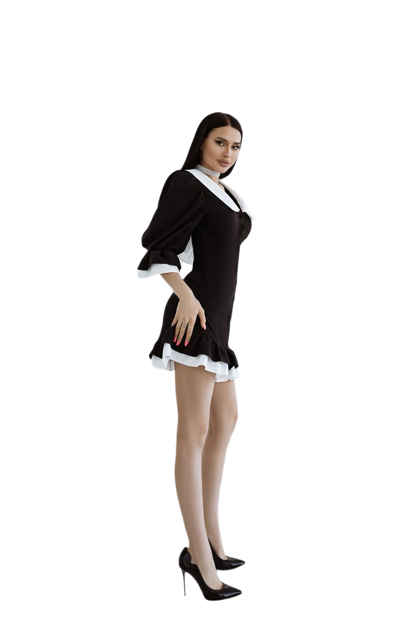 Woman wearing a black and white maid costume on a white background