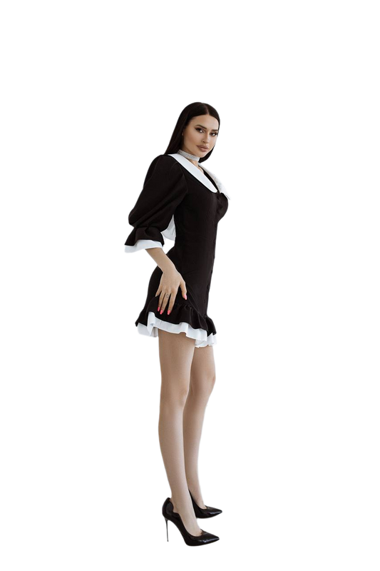 Woman wearing a black and white maid costume on a white background