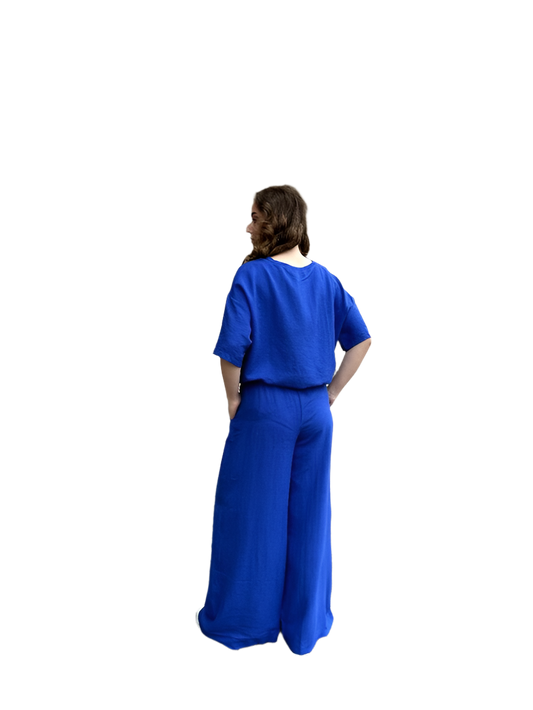 Person wearing a blue outfit on a white background
