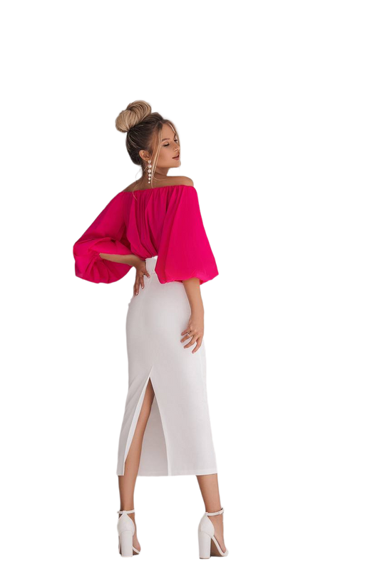Woman wearing a bright pink off-shoulder top and white skirt on a white background
