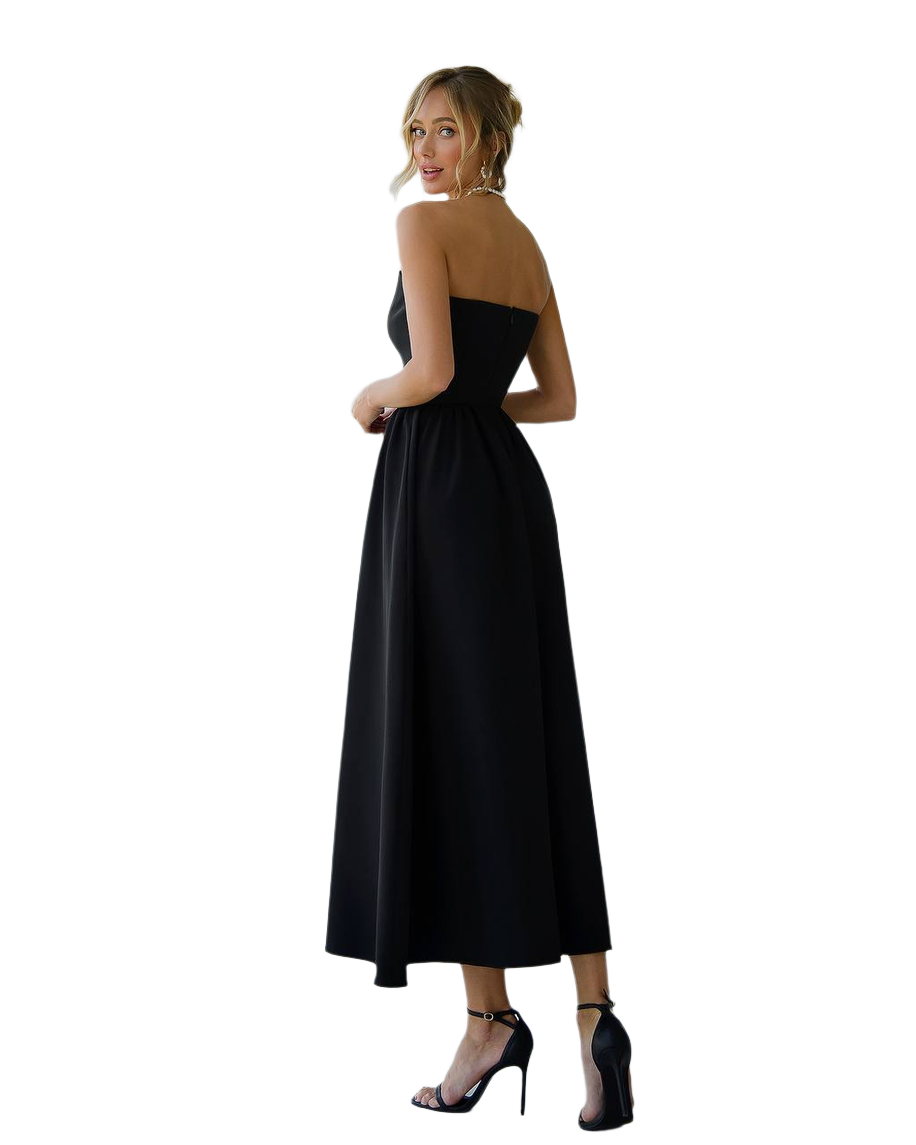 Woman wearing a black dress with a white background
