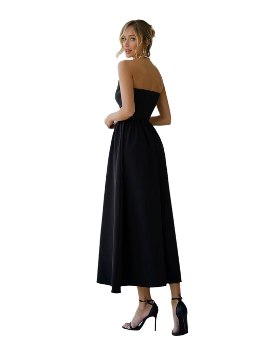 Woman wearing a black dress with a white background