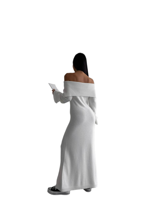 Woman wearing a white off-shoulder dress on a white background
