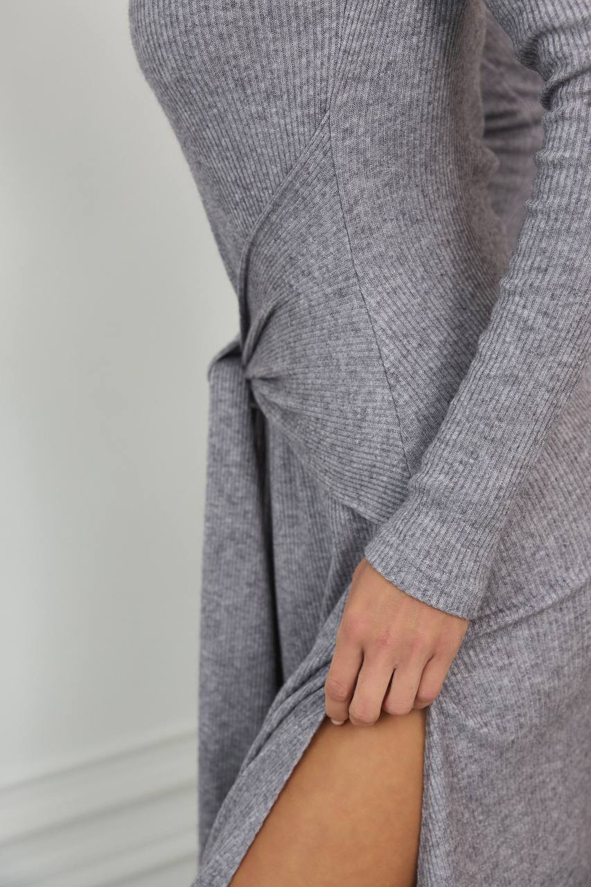 Gray knit dress with a plain background