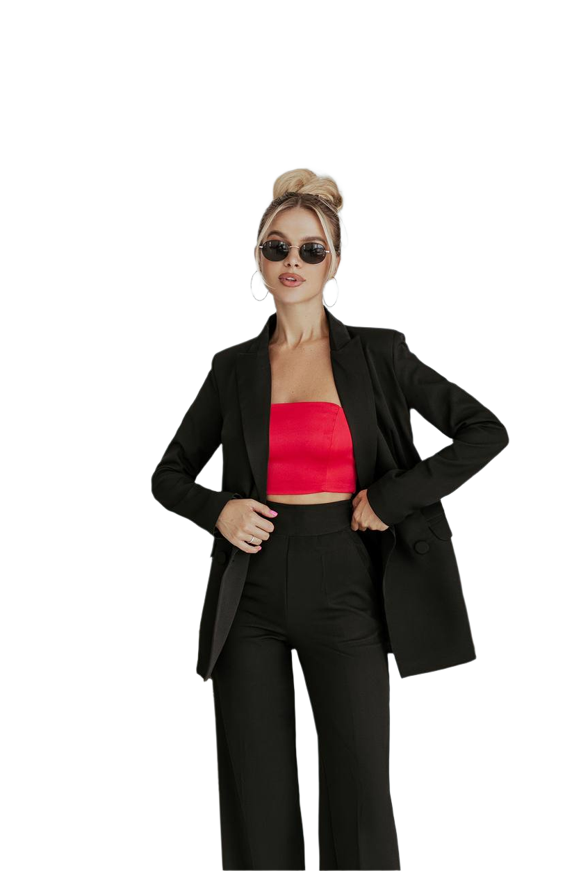 Woman wearing a black suit with a red top on a white background