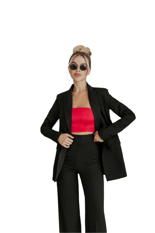 Woman wearing a black suit with a red top on a white background