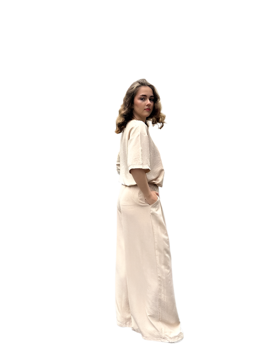 Woman wearing a beige long dress on a white background