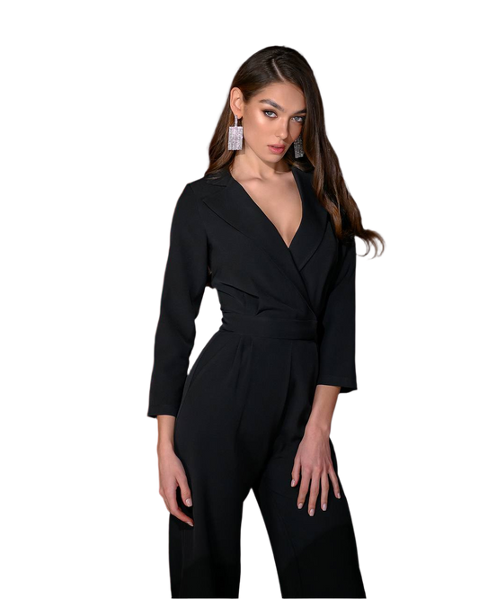 Woman wearing a black jumpsuit on a white background