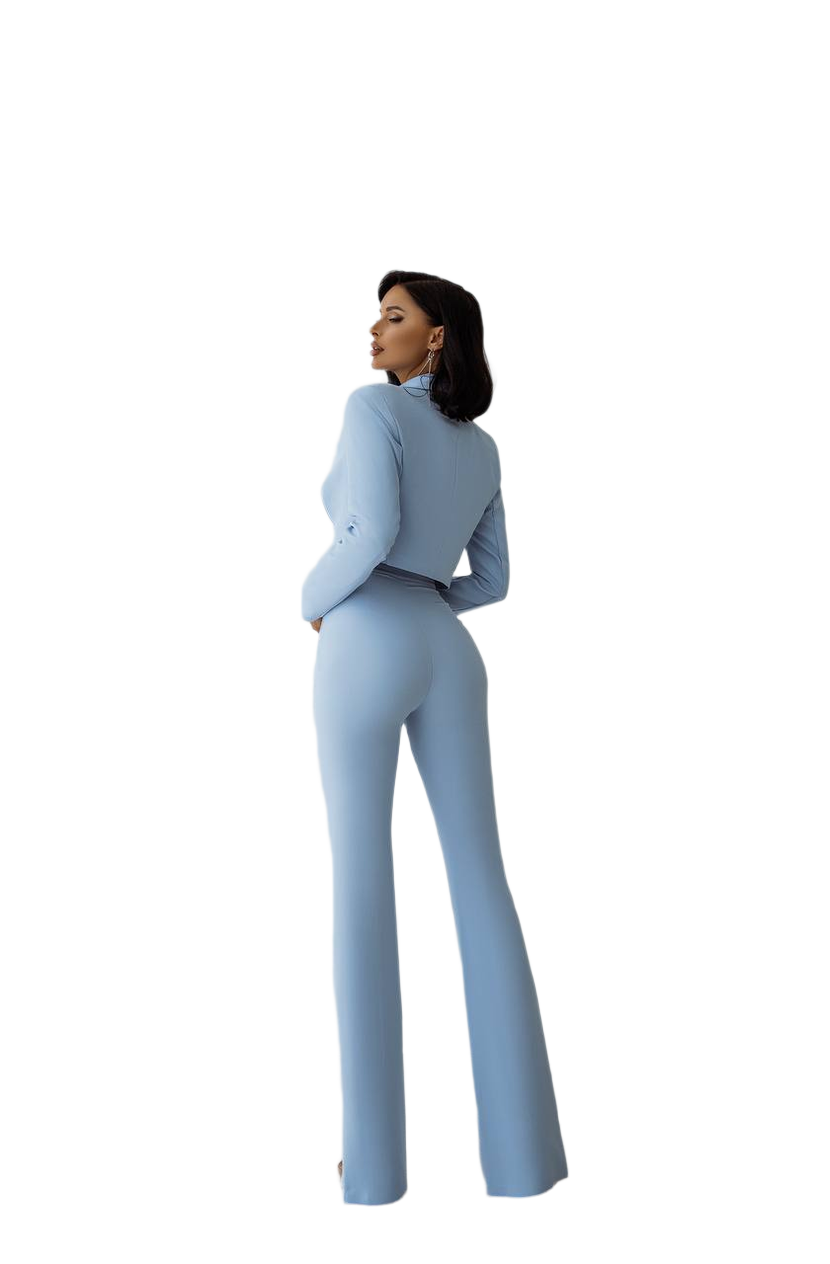 Woman wearing a light blue jumpsuit on a white background