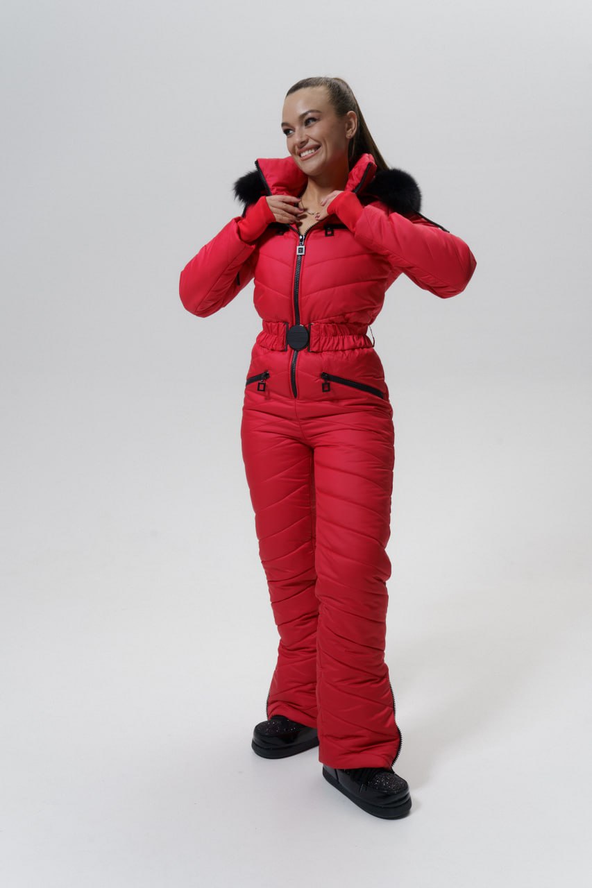 Person wearing a red snowsuit on a white background