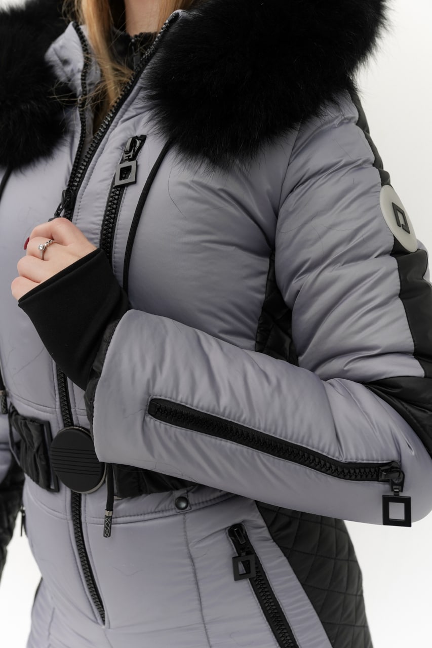 Gray winter jacket with black fur hood and accents on a white background