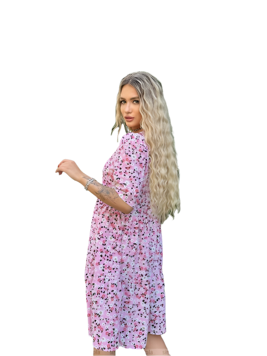 Woman wearing a pink floral dress on a white background