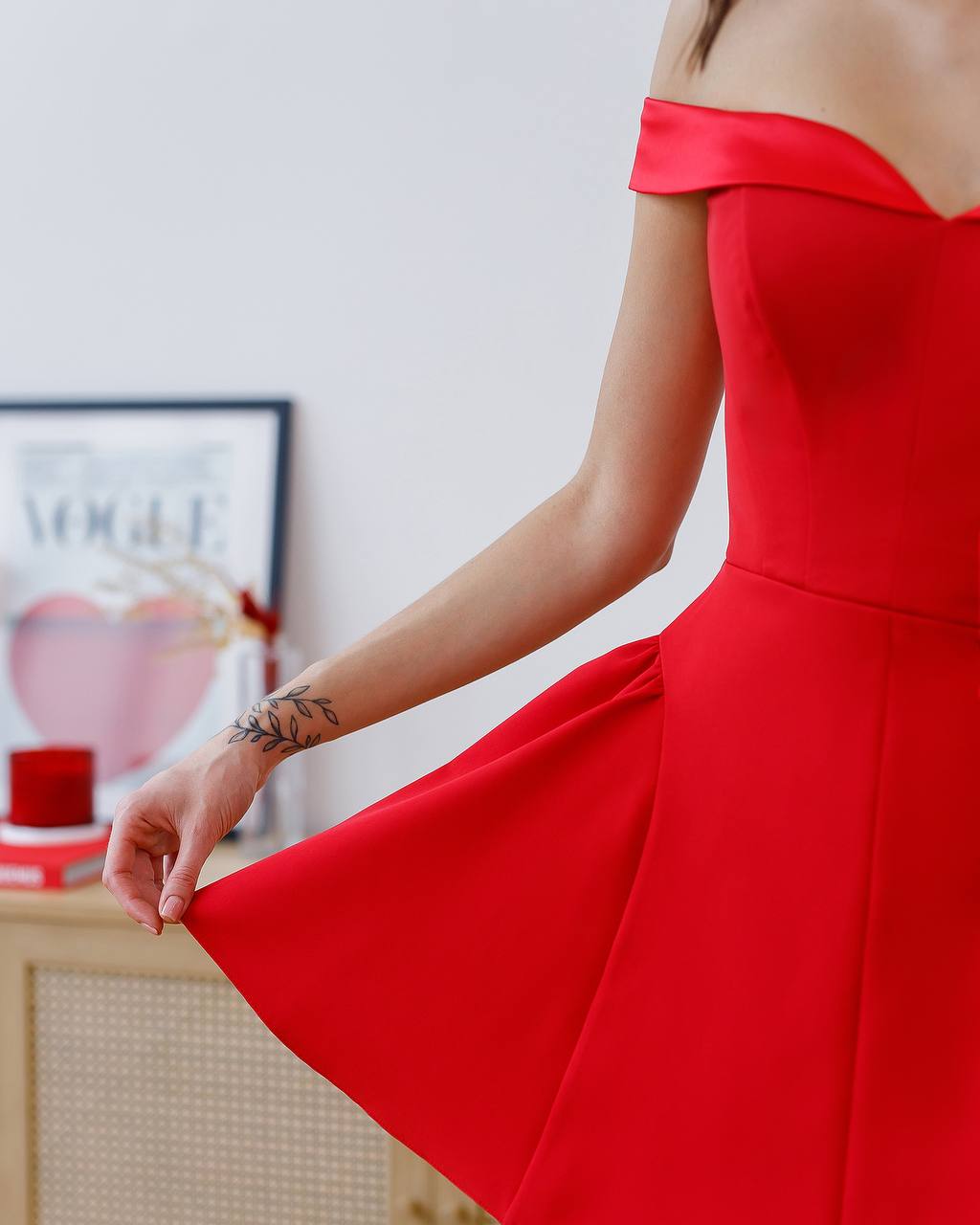 Red off-shoulder dress with a blurred background